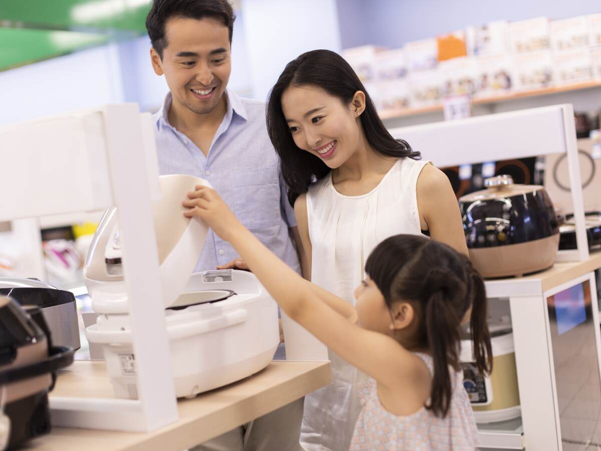 Family shopping in a consumer electronics store.